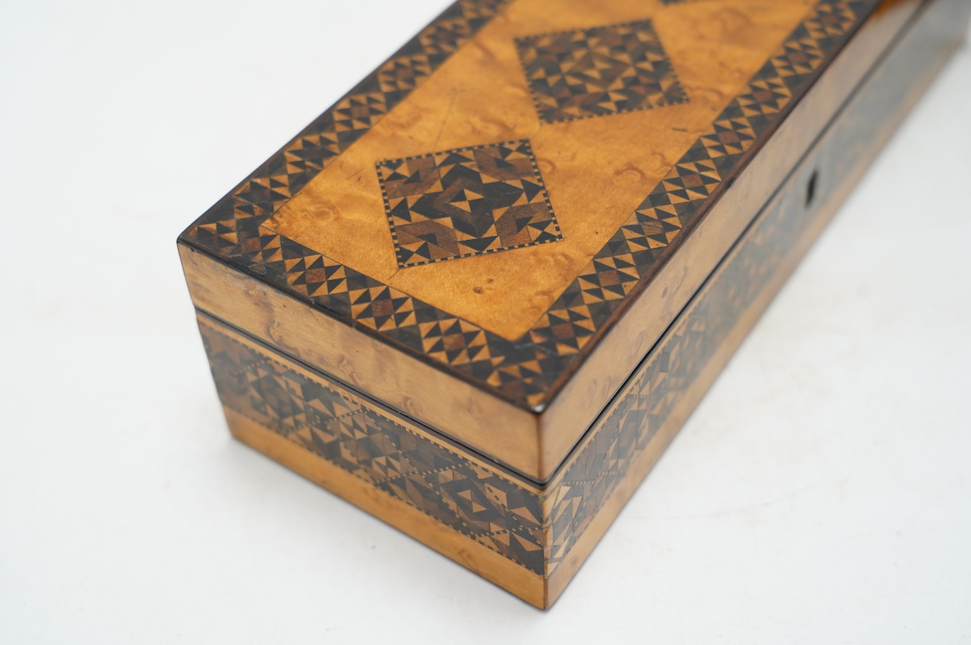 Two Tunbridgeware bird's eye maple half square mosaic glove boxes, c.1825-40, one with key, 24cm. Condition - fair to good